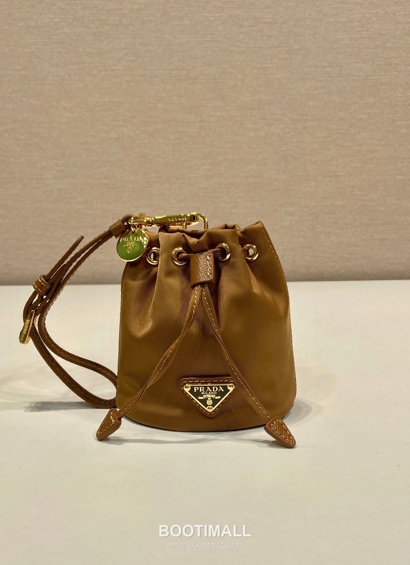 Prada Re-Nylon Mini Bucket Bag with Drawstring Closure and Leather Wrist Strap Detail 프라다 리나일론 드로우스트링 가죽 손목 스트랩 미니 버킷백 1TT202 8.5cm 2