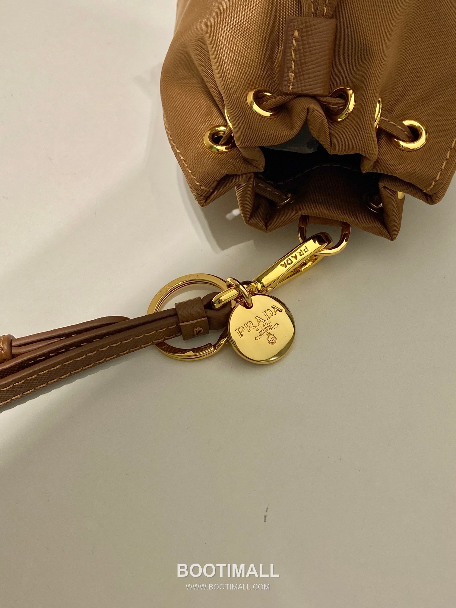 Prada Re-Nylon Mini Bucket Bag with Drawstring Closure and Leather Wrist Strap Detail 프라다 리나일론 드로우스트링 가죽 손목 스트랩 미니 버킷백 1TT202 8.5cm 7