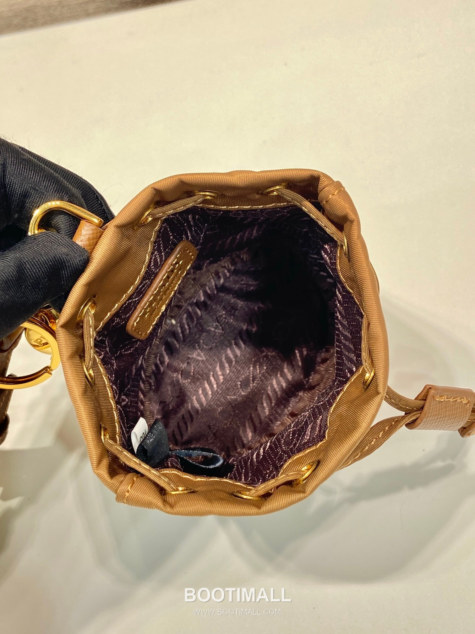 Prada Re-Nylon Mini Bucket Bag with Drawstring Closure and Leather Wrist Strap Detail 프라다 리나일론 드로우스트링 가죽 손목 스트랩 미니 버킷백 1TT202 8.5cm 8