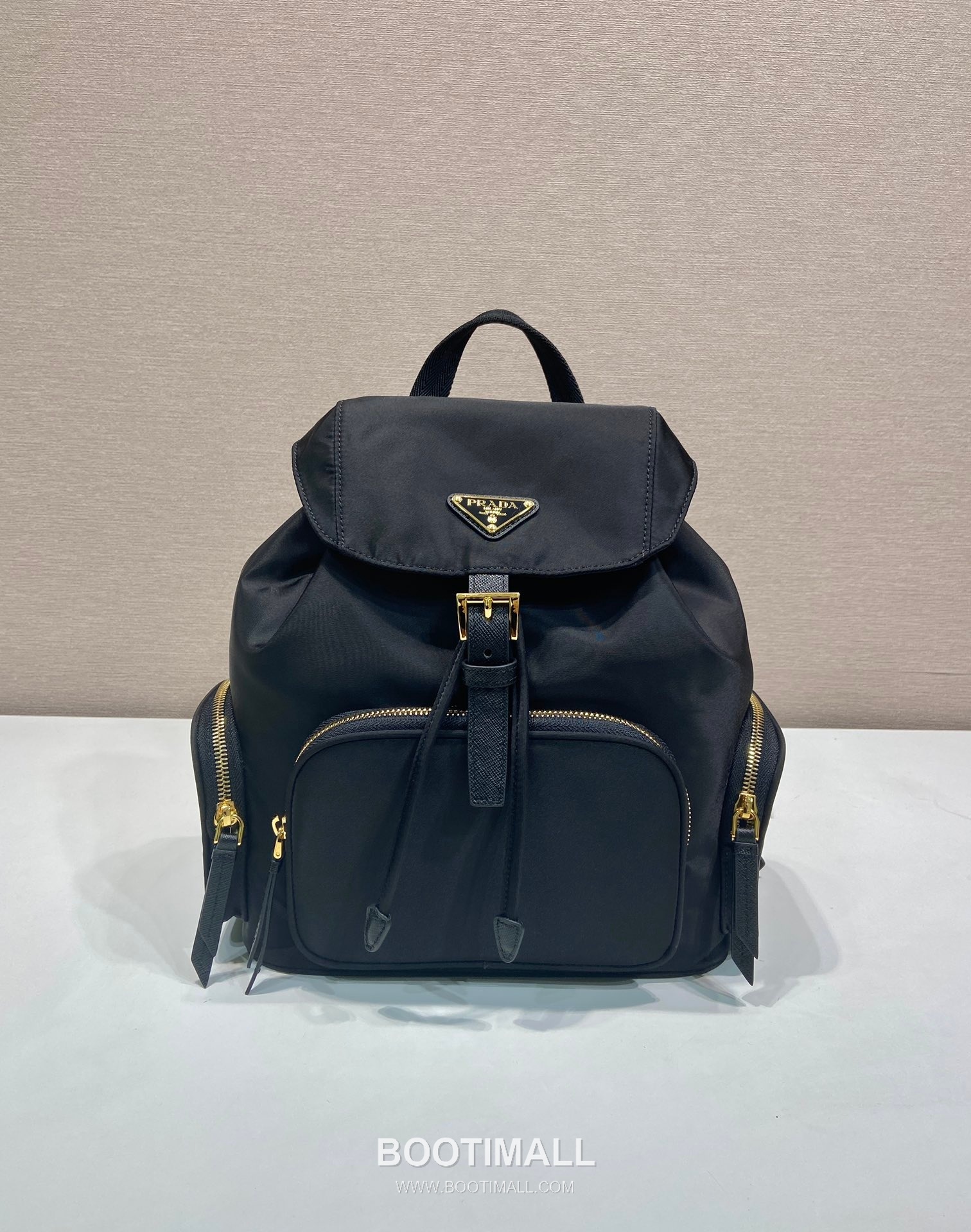 Prada Re-Nylon Backpack with Flap Drawstring Closure and Triple Zip Pocket Detail 프라다 리나일론 플랩 드로우스트링 트리플 지퍼 포켓 백팩 1BZ081 24.5cm 1