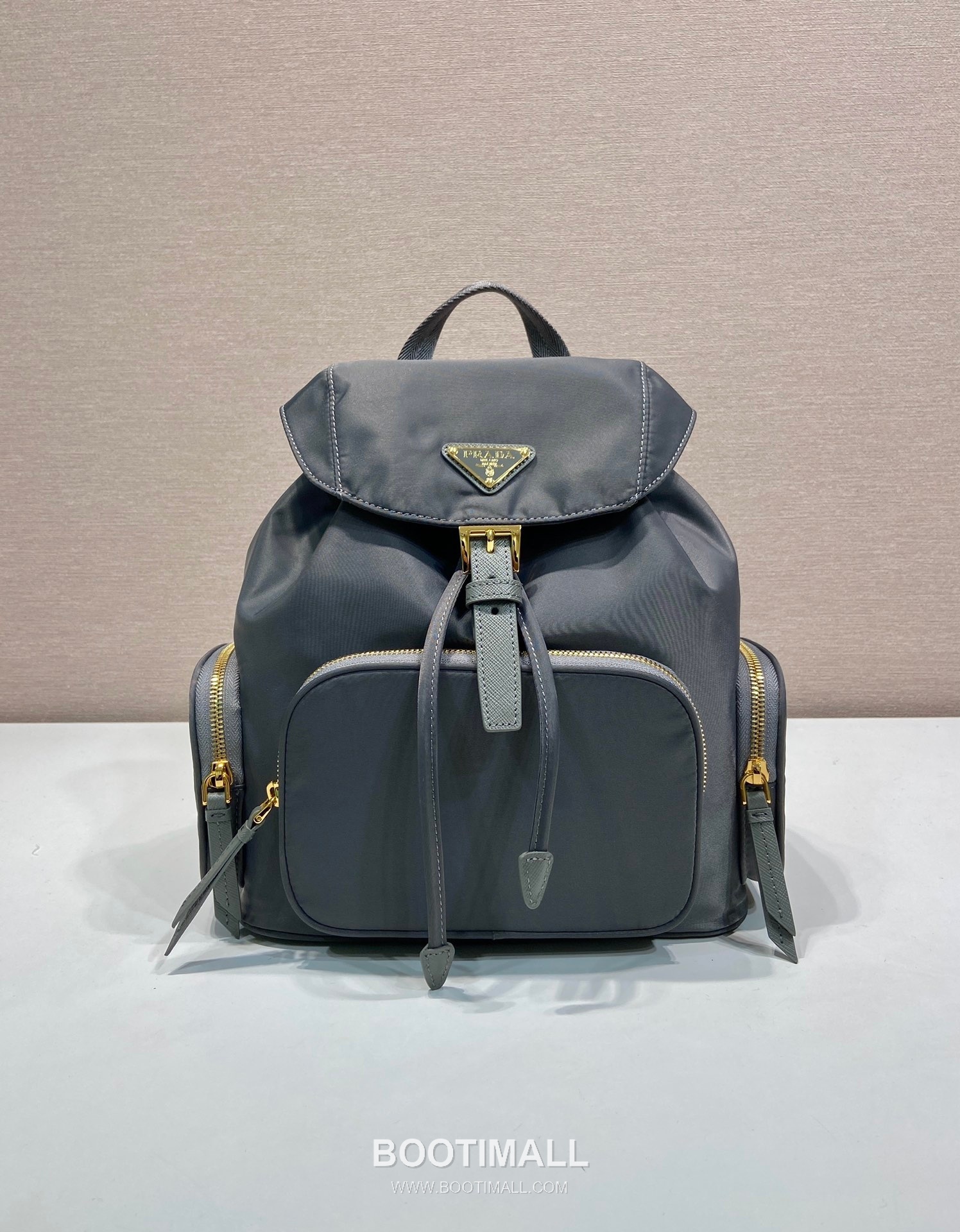 Prada Re-Nylon Backpack with Flap Drawstring Closure and Triple Zip Pocket Detail 프라다 리나일론 플랩 드로우스트링 트리플 지퍼 포켓 백팩 1BZ081 24.5cm 1