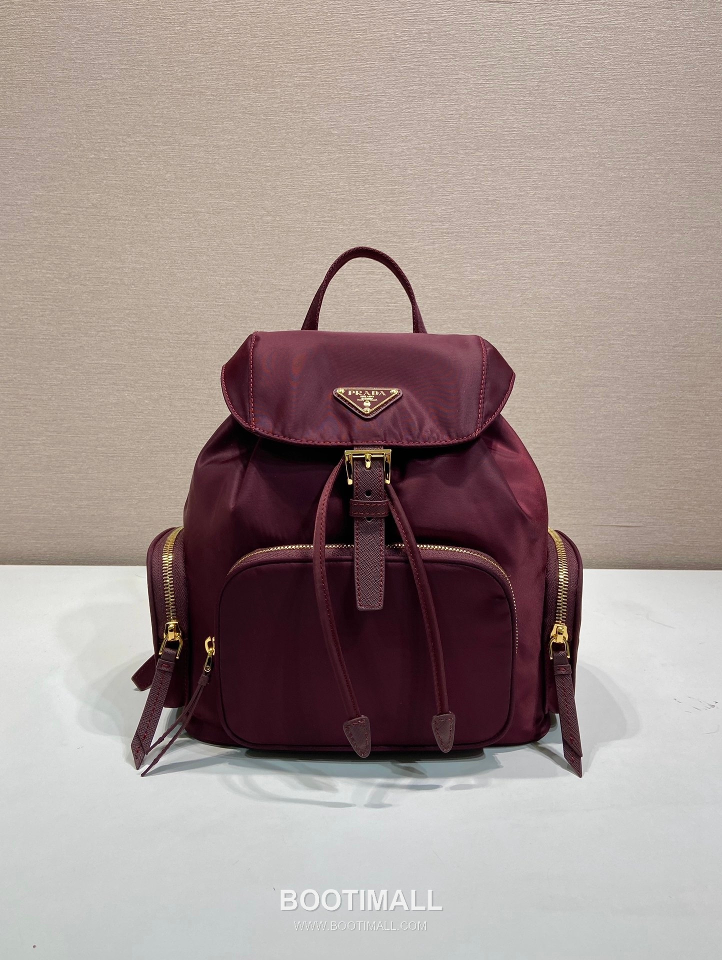 Prada Re-Nylon Backpack with Flap Drawstring Closure and Triple Zip Pocket Detail 프라다 리나일론 플랩 드로우스트링 트리플 지퍼 포켓 백팩 1BZ081 24.5cm 1