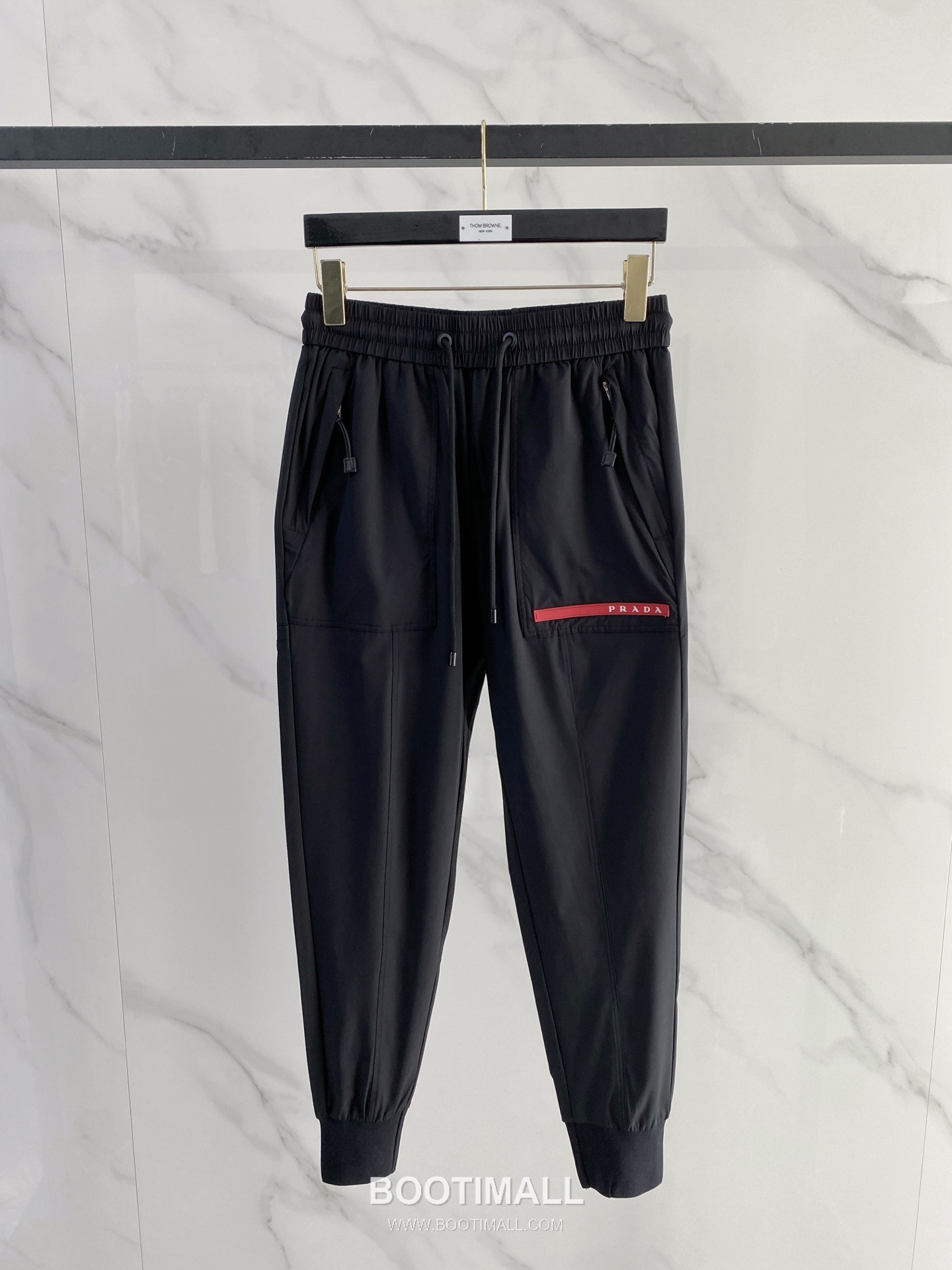 Prada 2026 SS Lyocell Nylon Stretch Pants with Logo Detail 프라다 2026 SS 텐셀 나일론 스트레치 팬츠 로고 디테일 1